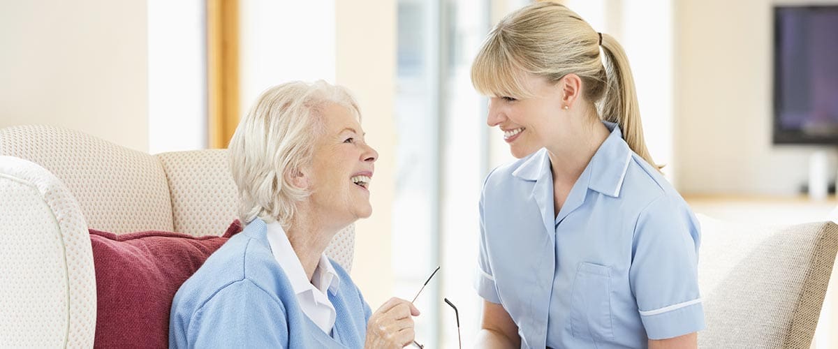 TLC Your Way Home Care Services | York County, Marion County, Florence / Darlington County | smiling caregiver assisting elderly woman in home